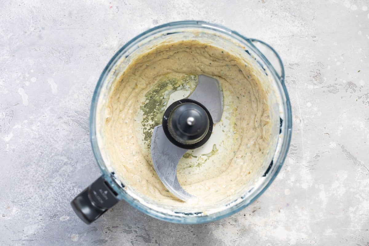 Walnut sauce in a food processor.