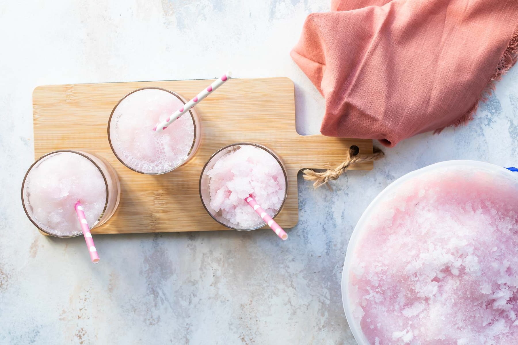 Pink lemonade vodka slush in a short clear glass.
