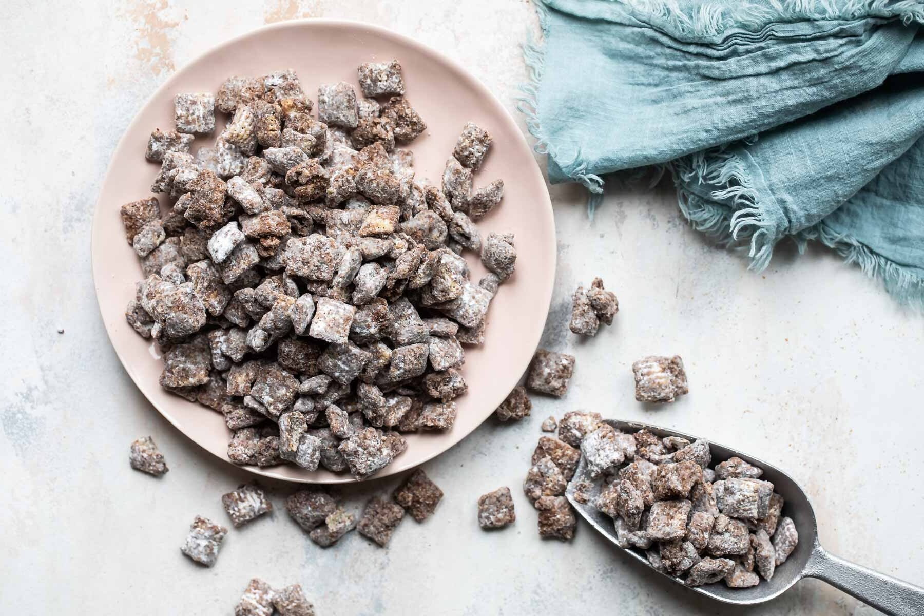 Puppy chow on a beige platter.