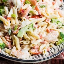 Seafood salad on a black and white platter.