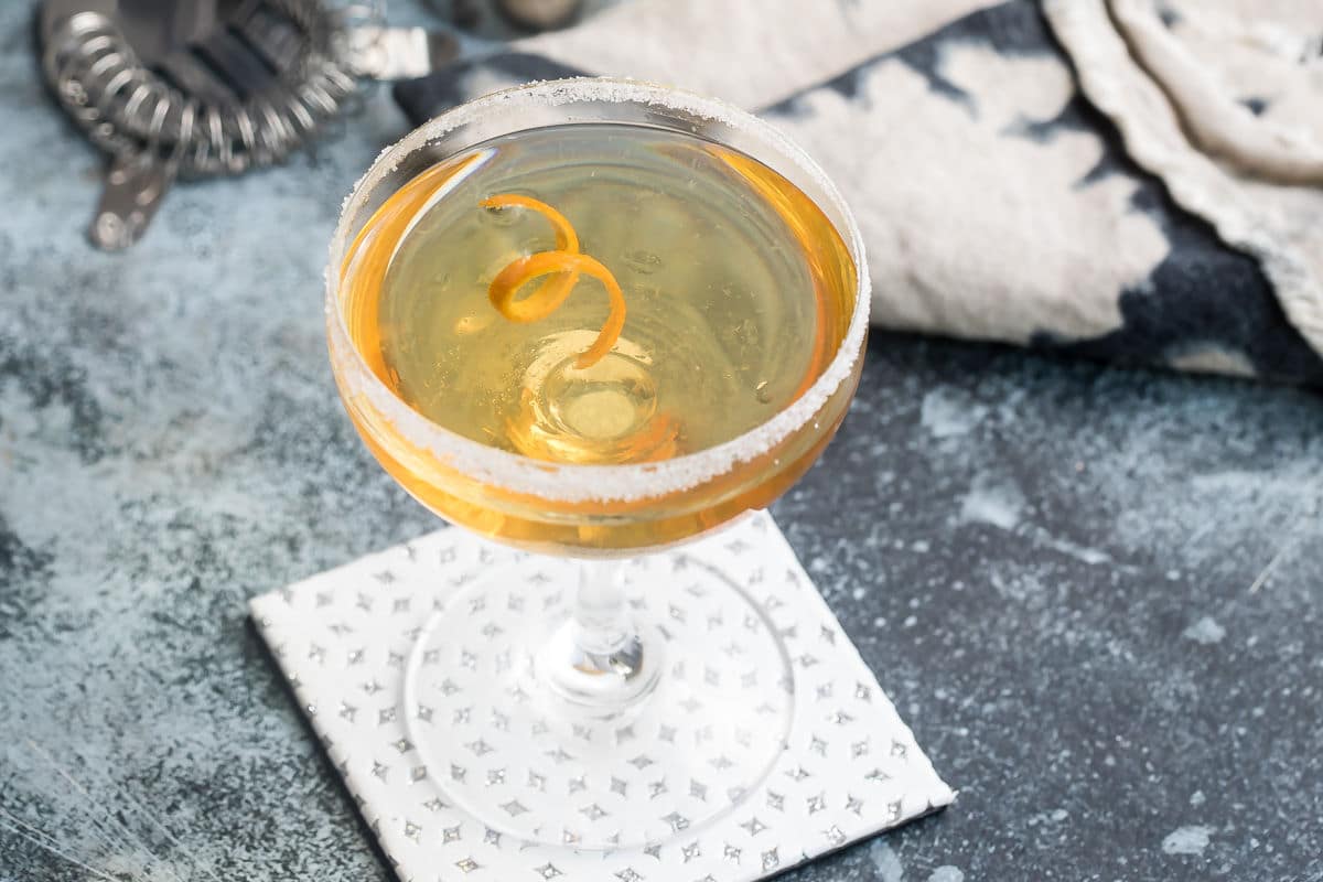 Sidecar cocktails in two clear stemmed glasses.