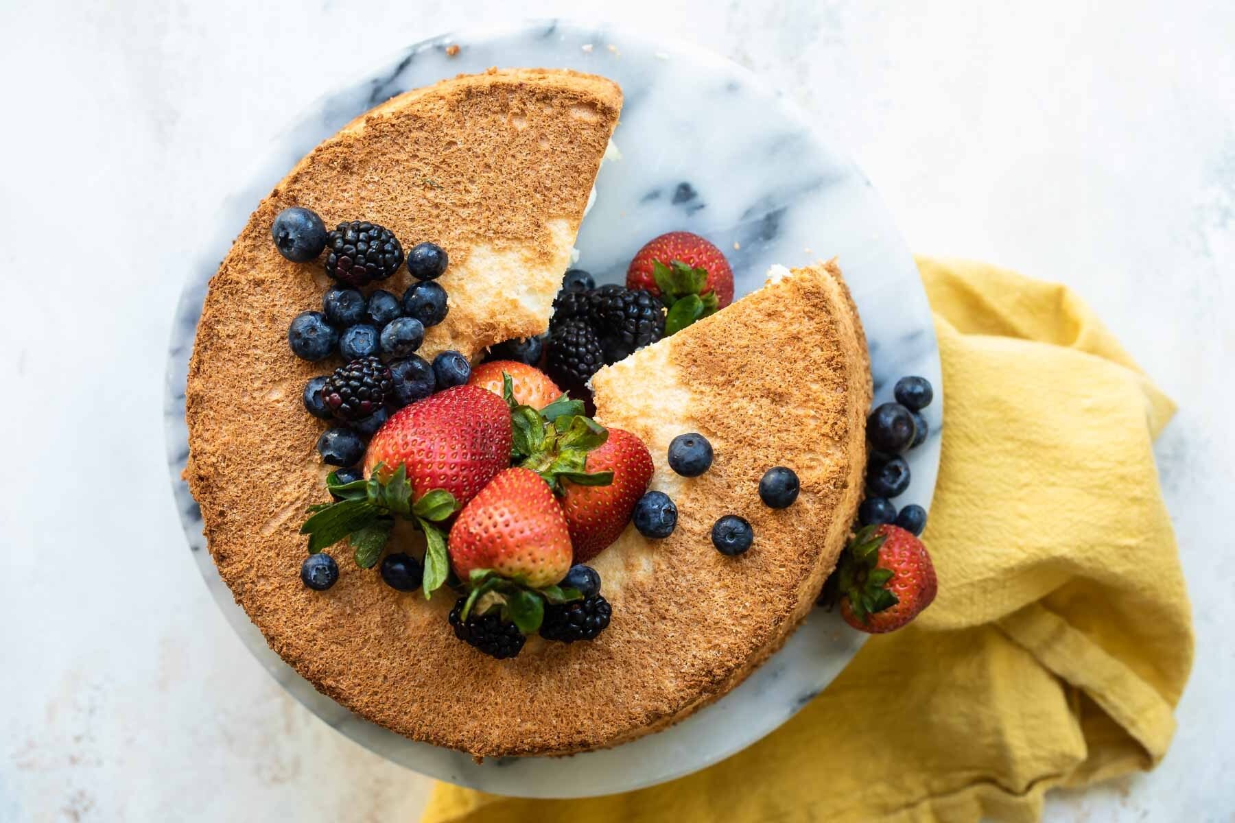 Angel food cake with fresh berries on top.