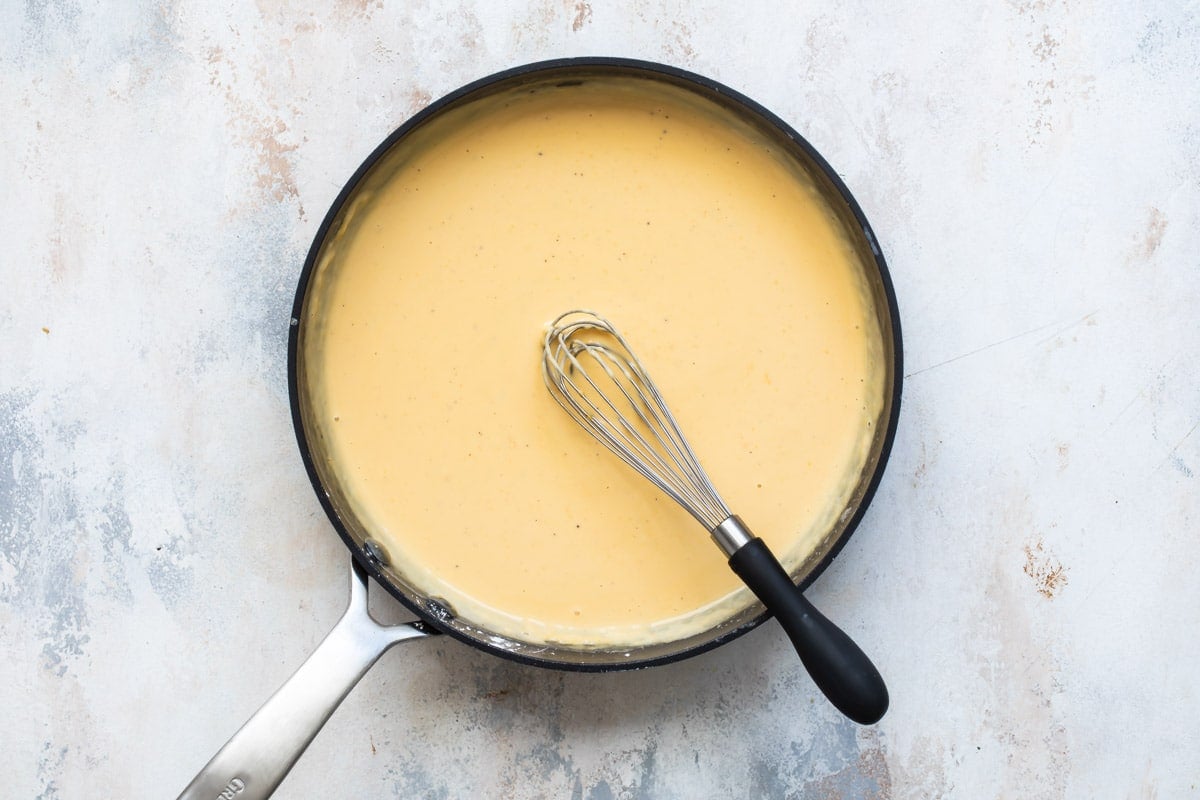 Homemade cheese sauce in a pan.