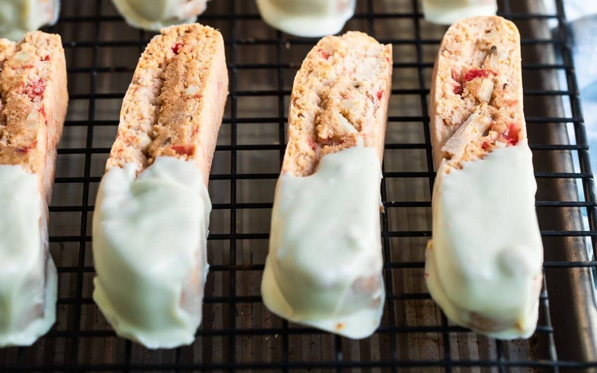 Cherry almond biscotti on a cooling rack.