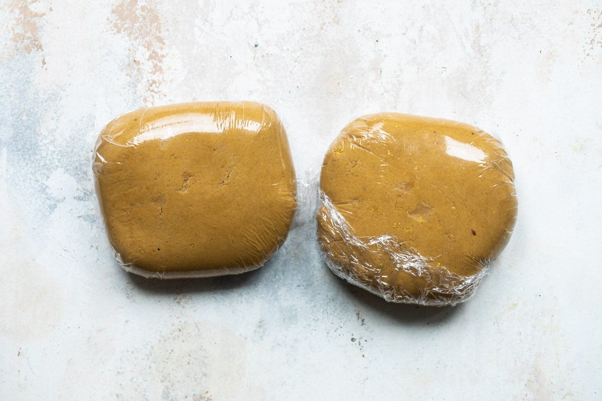 Two discs of ginger bread cookie dough.