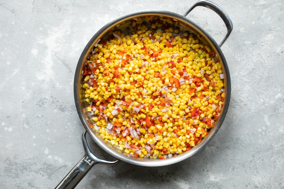 Cooking corn and peppers for hot corn dip.
