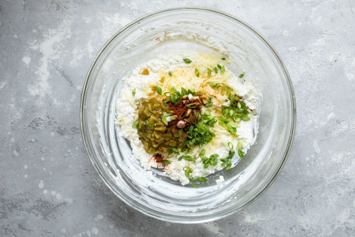 Ingredients for hot corn dip in a bowl.