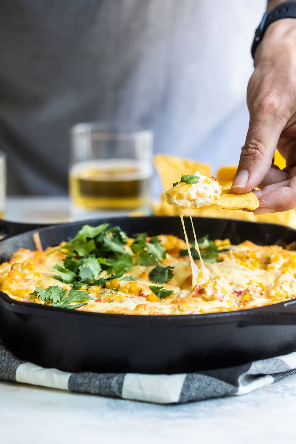 A skillet with hot corn dip.