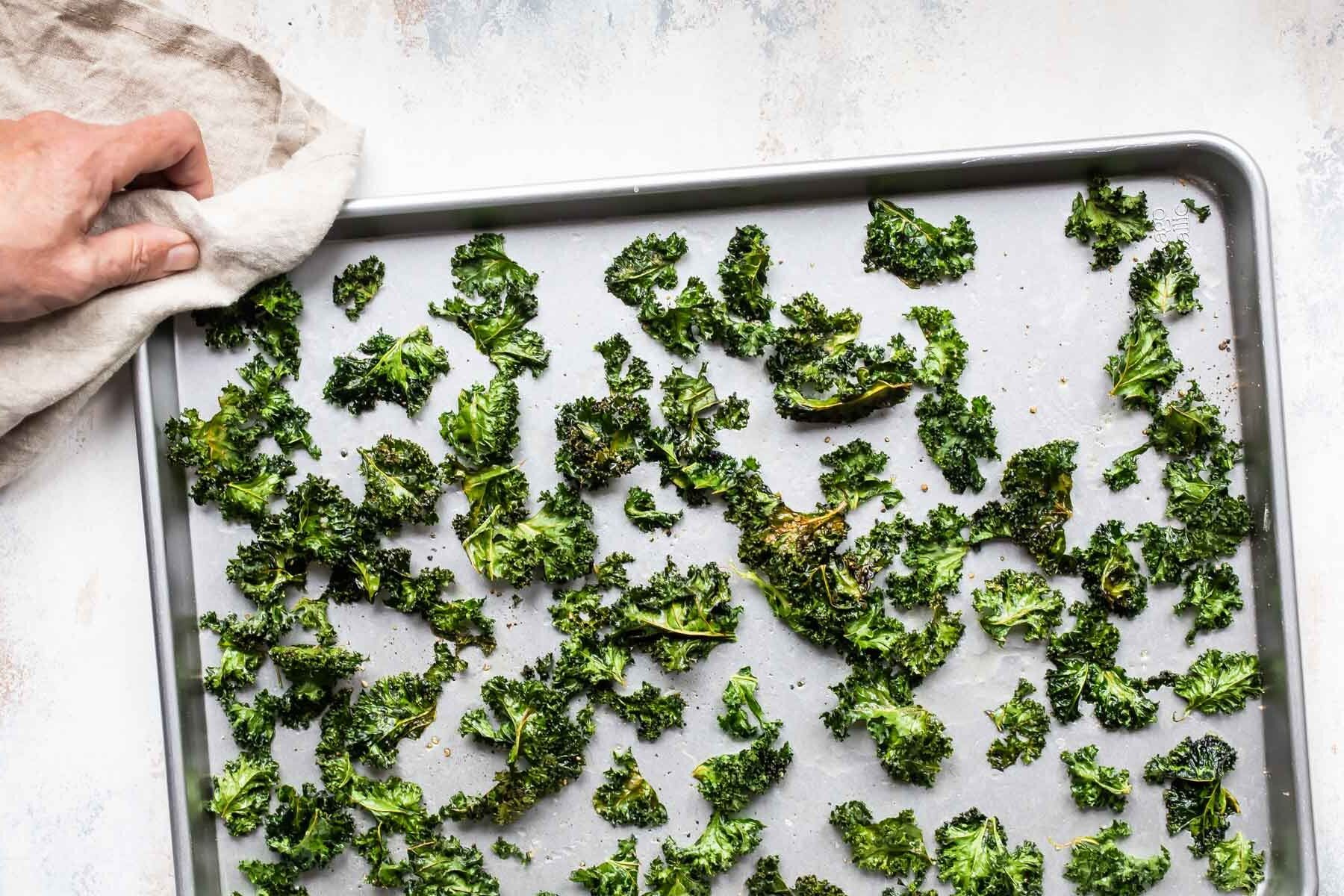 Kale chips on a baking sheet.