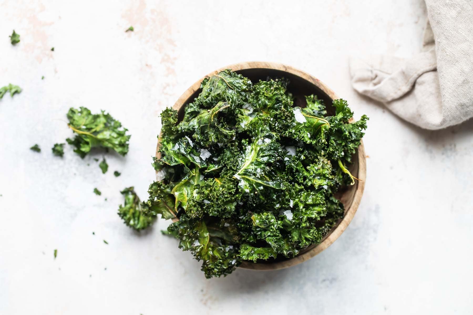 A bowl of baked kale chips.