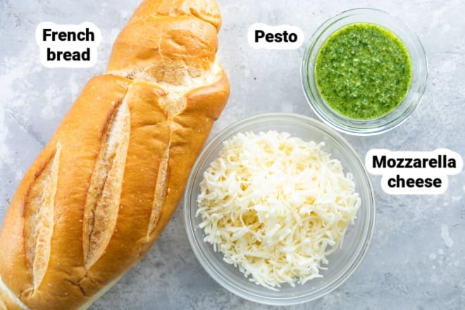 Labeled ingredients for pesto cheese bread.