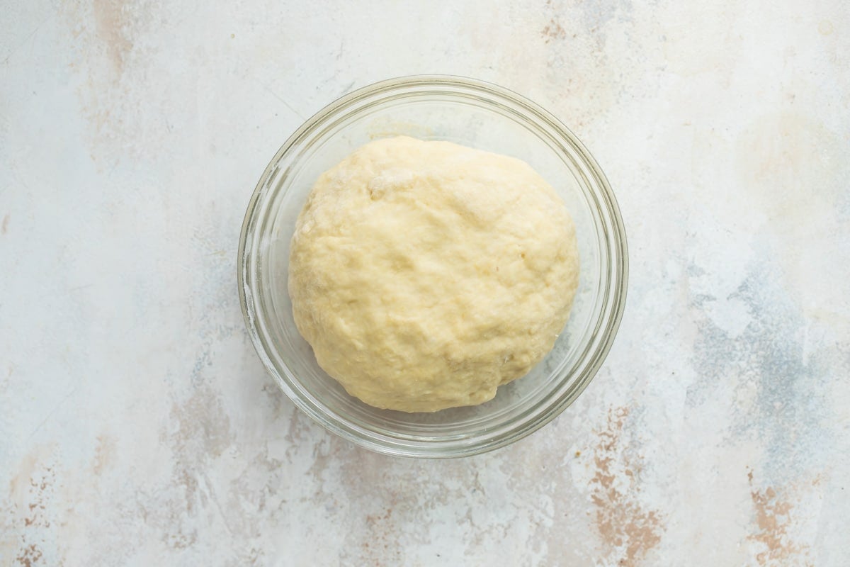 A bowl of apple strudel dough proofing.
