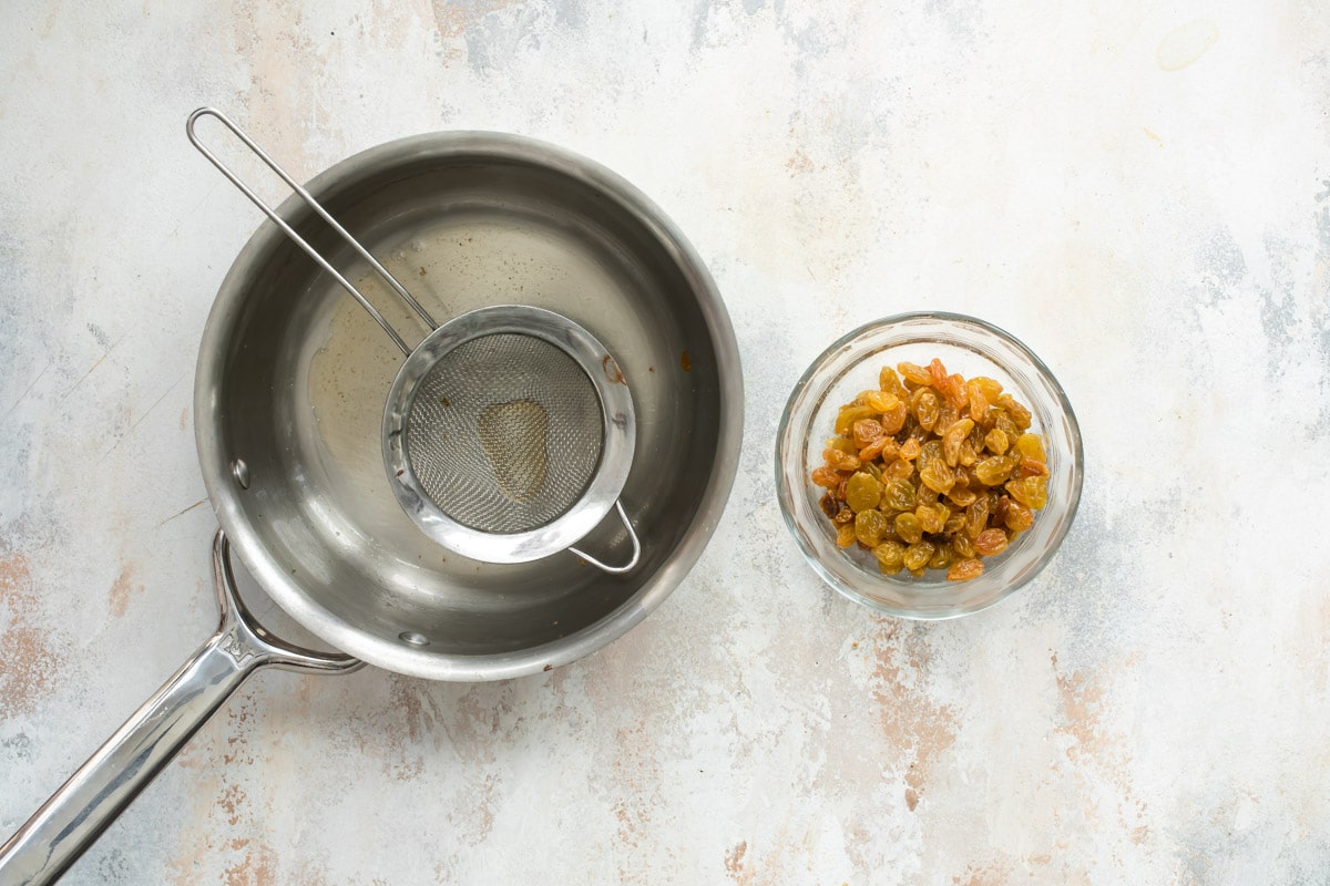 Soaking the dried fruit for apple strudels.