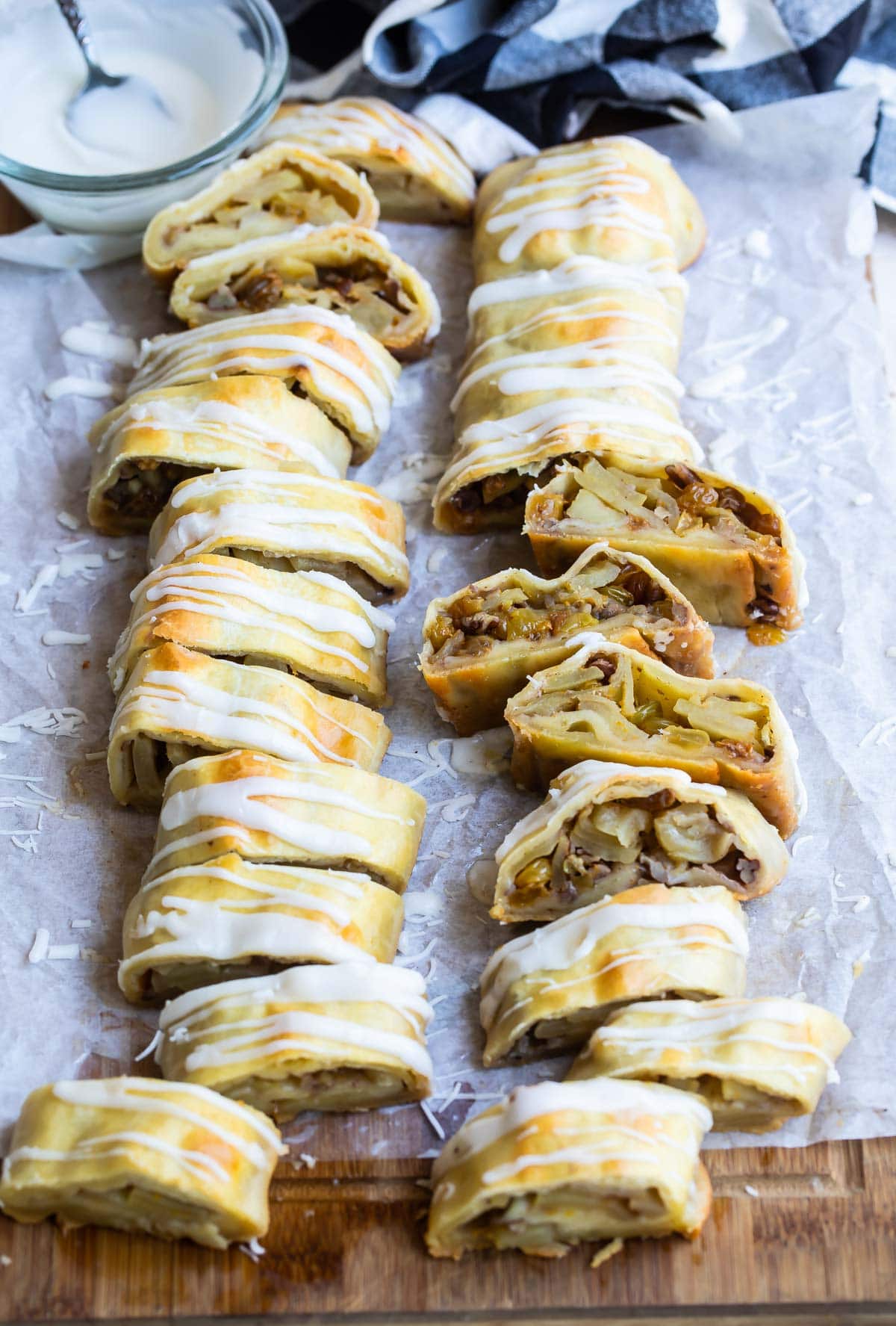 Two apple strudels on a baking sheet.