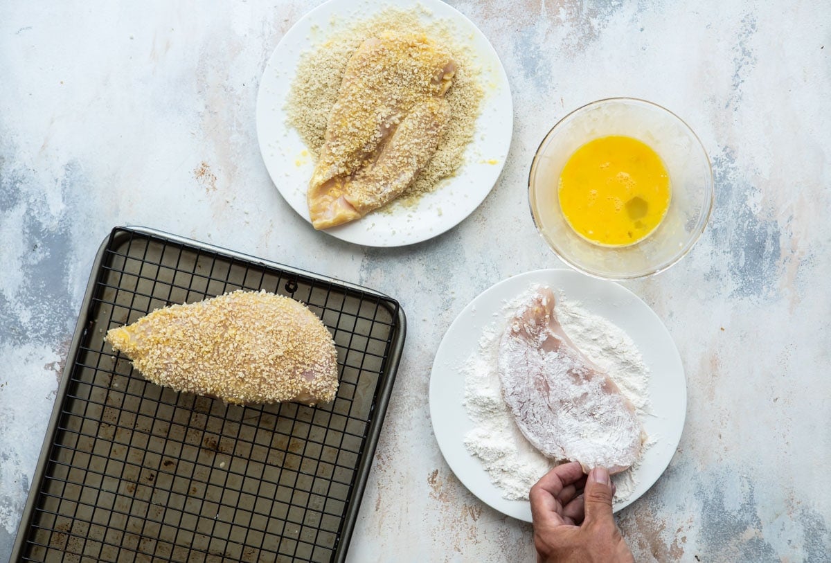 Breading chicken cutlets.