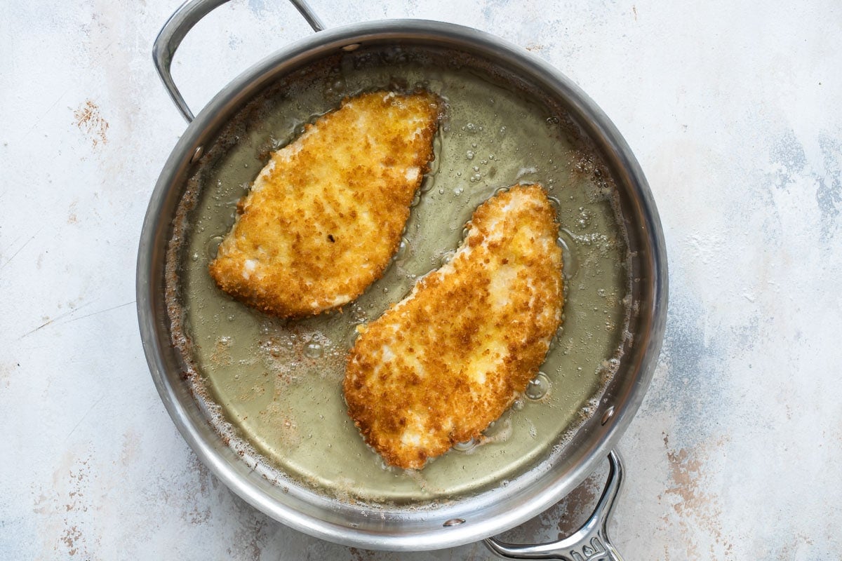 Frying chicken cutlets.