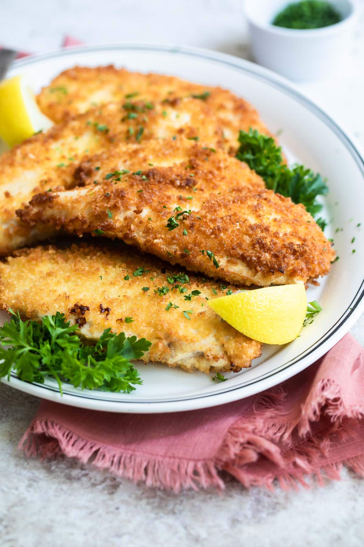 A plate of chicken schnitzel.