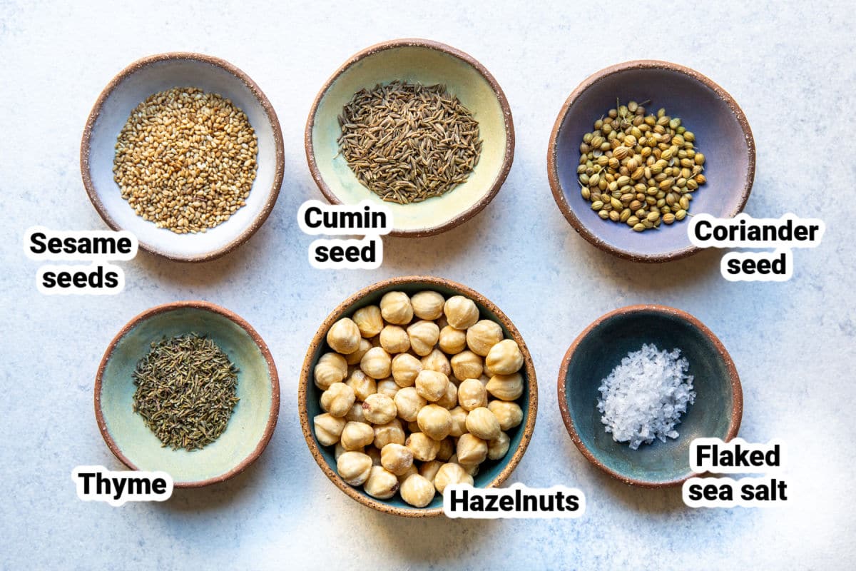 Bowls of seeds and nuts labeled for dukkah.