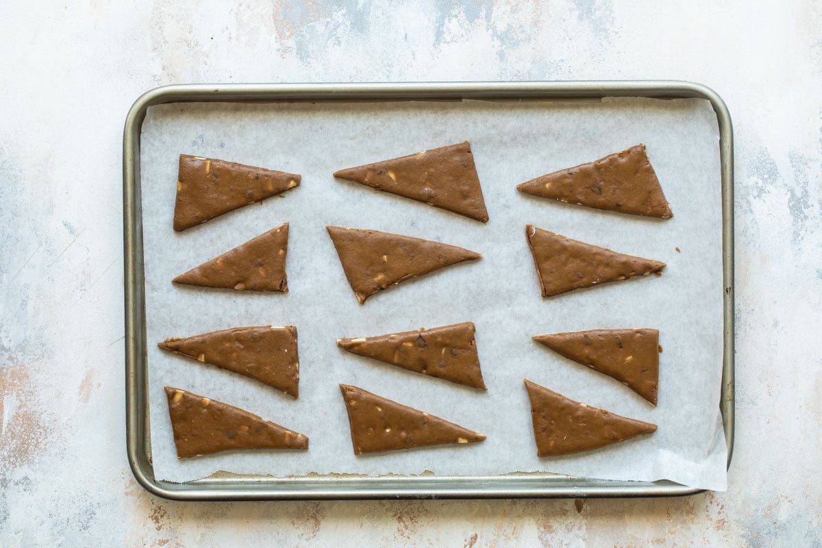 Lebkuchen cookies on a baking sheet before baking.