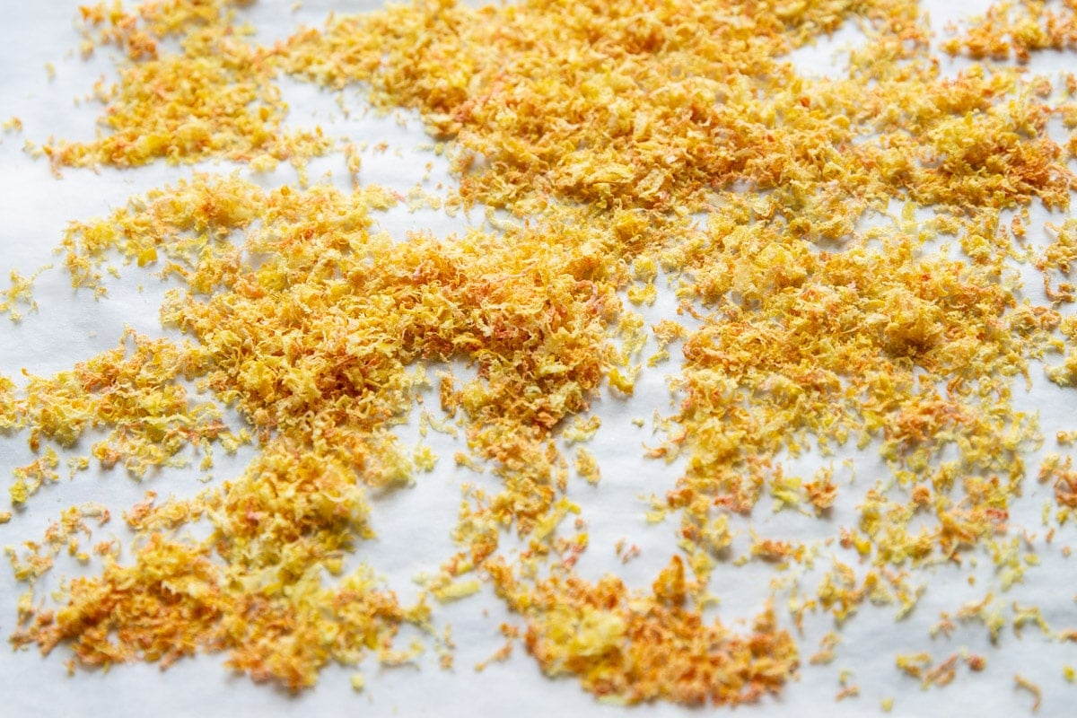Dried lemon zest on a baking sheet.