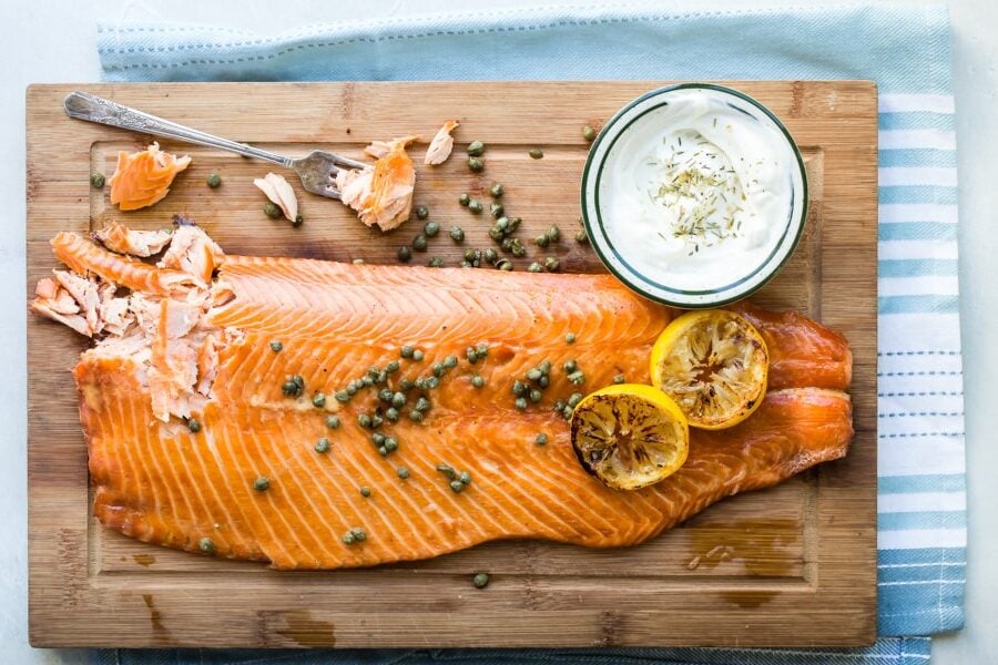 Smoked salmon on a wood cutting board.