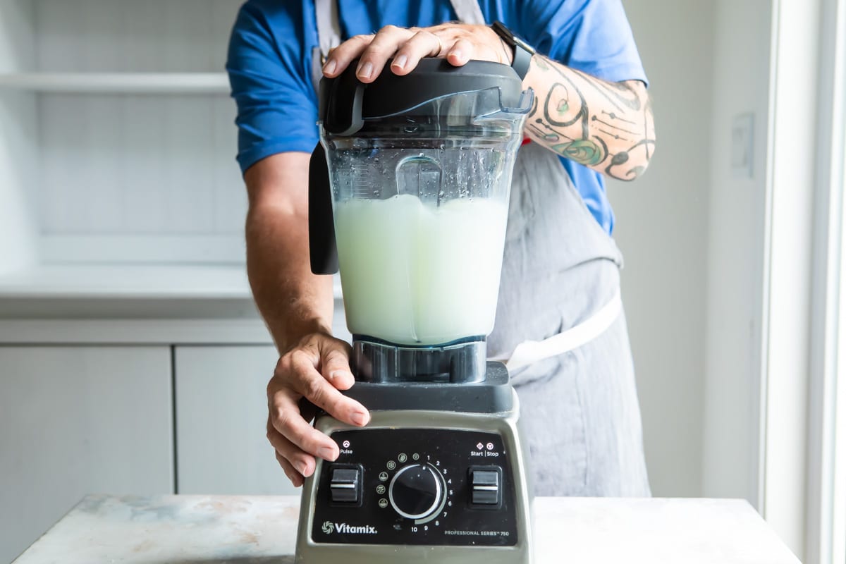 Making lemonade in a pitcher.