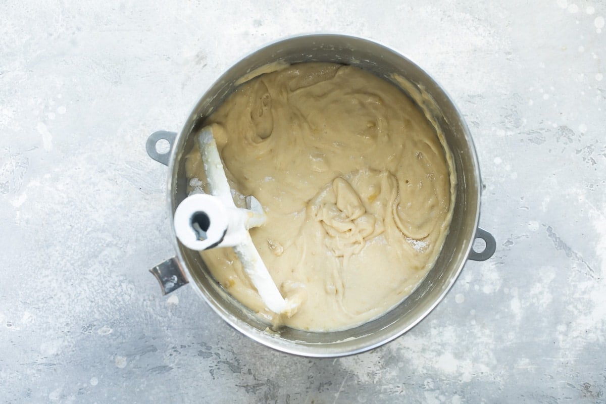 Banana bar batter in a silver mixing bowl.
