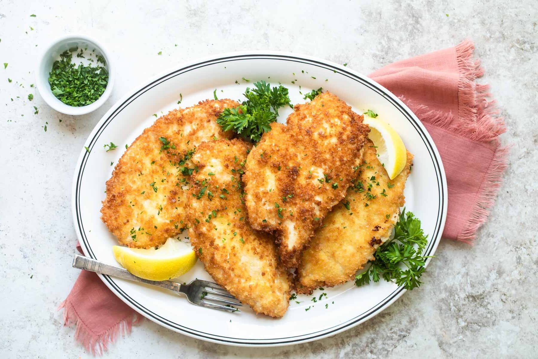 A plate of chicken schnitzel.
