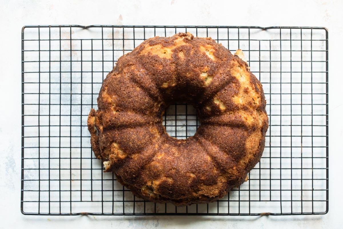 Cinnamon Apple Cake on a cooling rack.