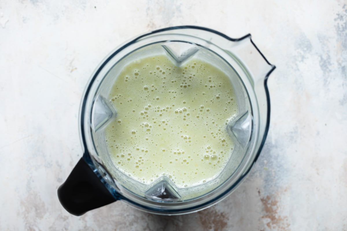 Light green liquid in a blender pitcher.