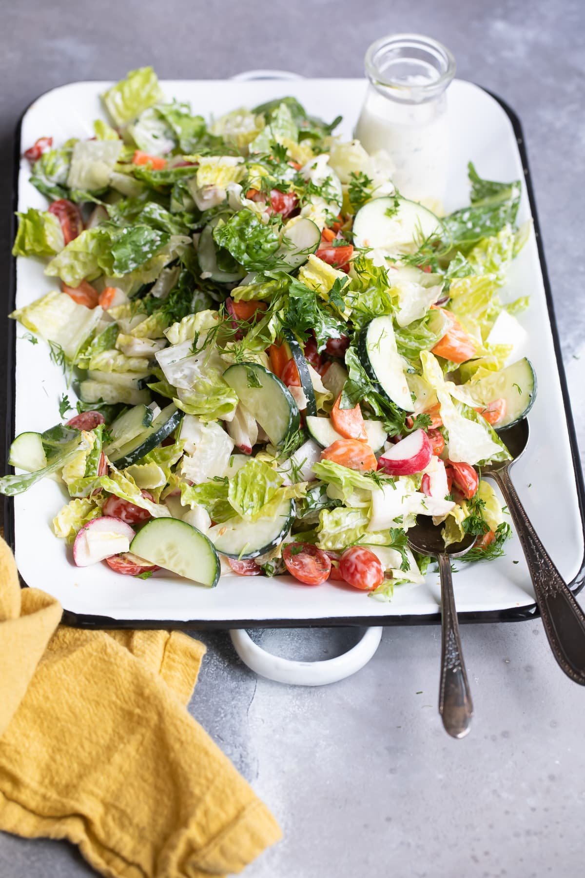 Easy garden salad on a white platter.