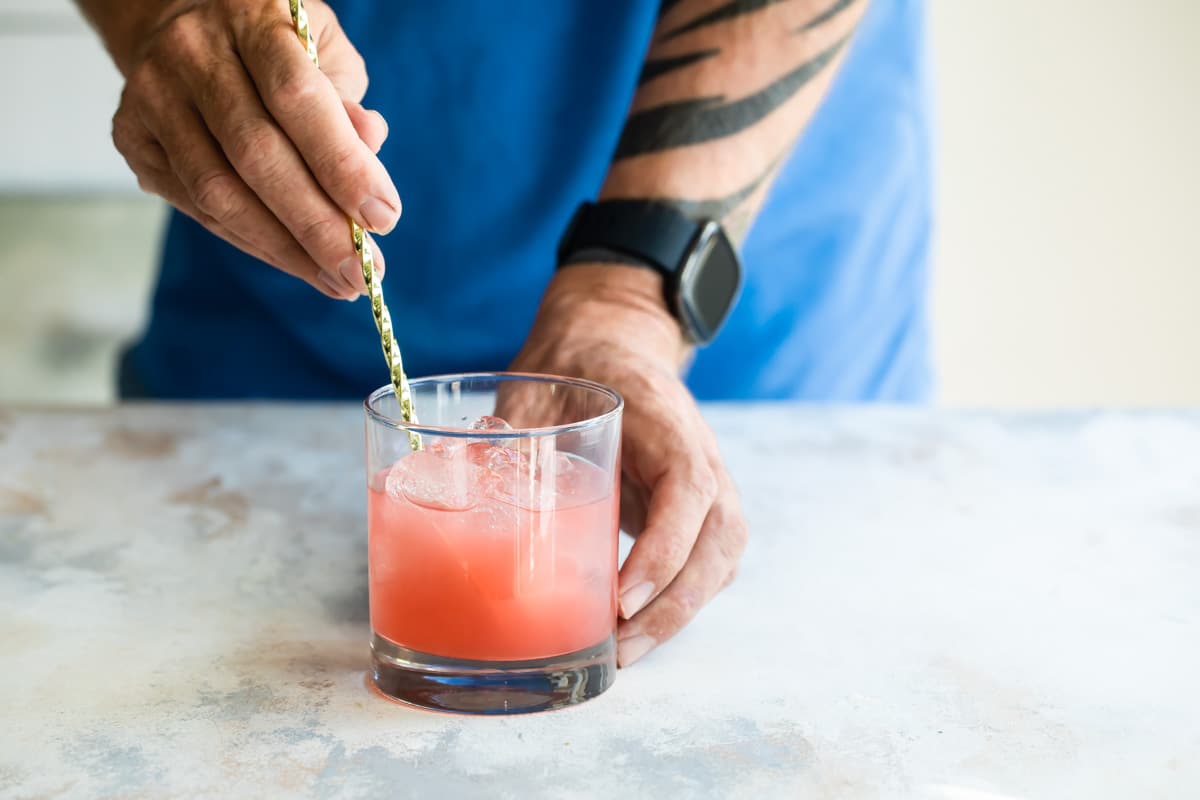 Mixing a Greyhound cocktail.