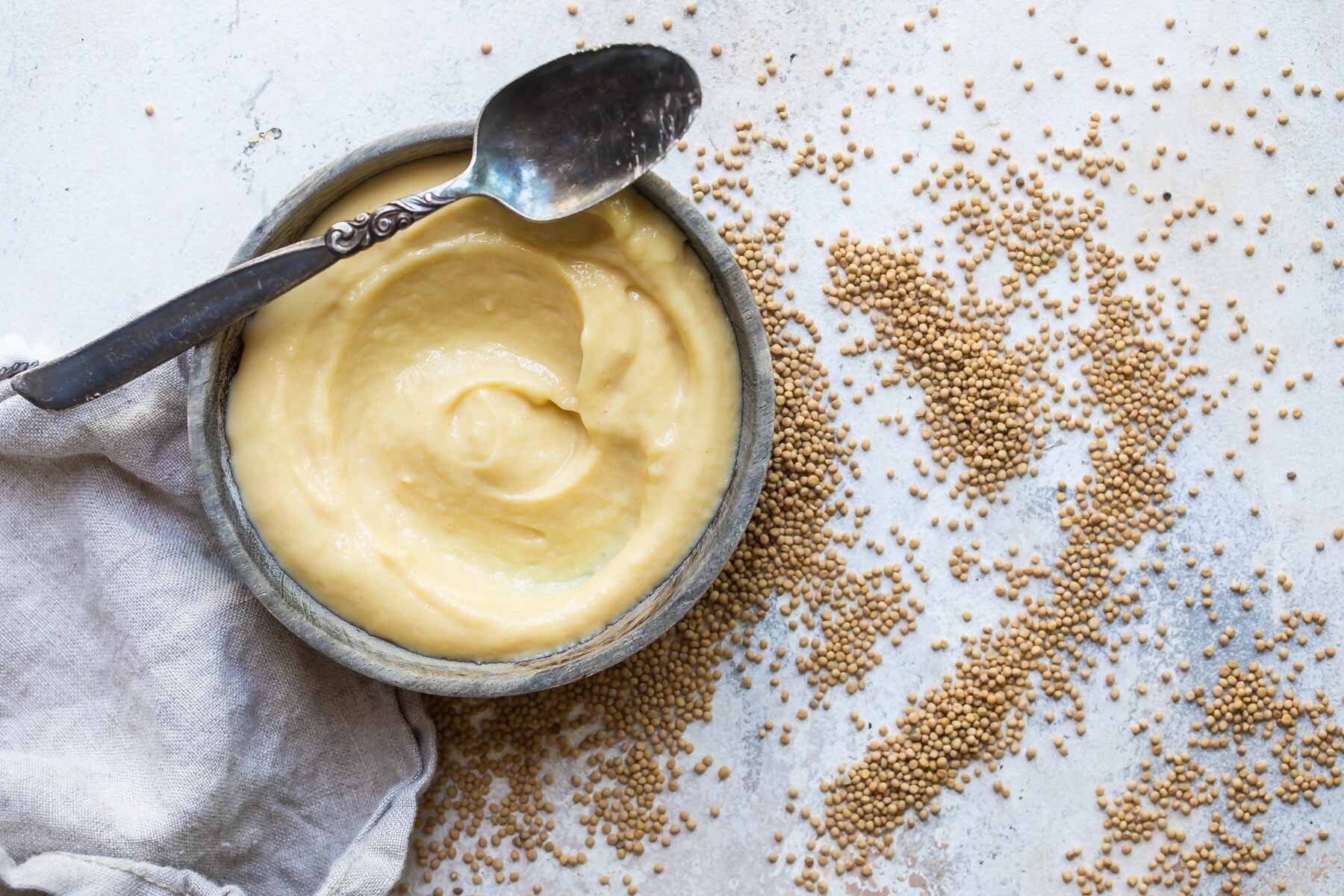 A bowl of homemade yellow mustard.