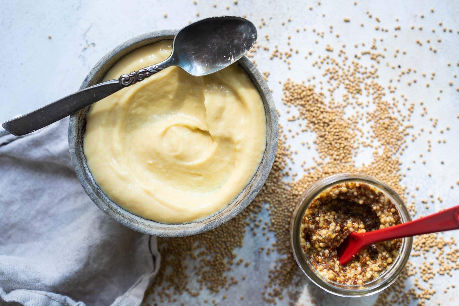 Homemade yellow mustard and whole grain mustard.
