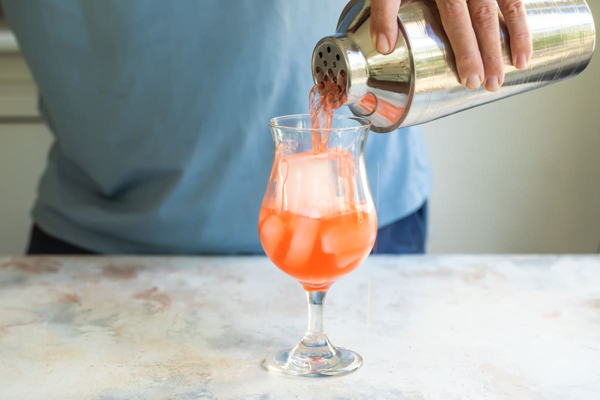 Mixing up a hurricane cocktail.