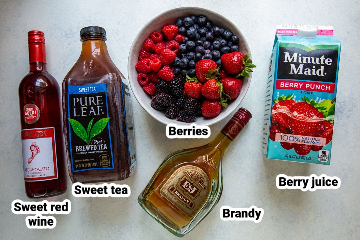Labeled ingredients for iced tea berry sangria.