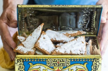 Glazed Lebkuchen on a cutting board.