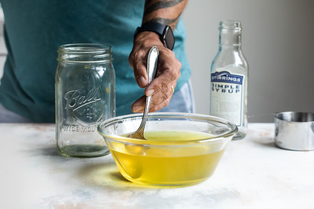 Adding vodka to limoncello.