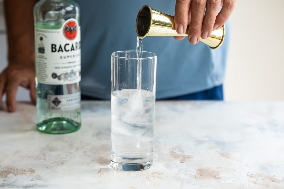 Mixing a long island iced tea.