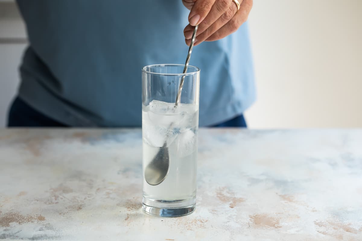 Mixing a long island iced tea.