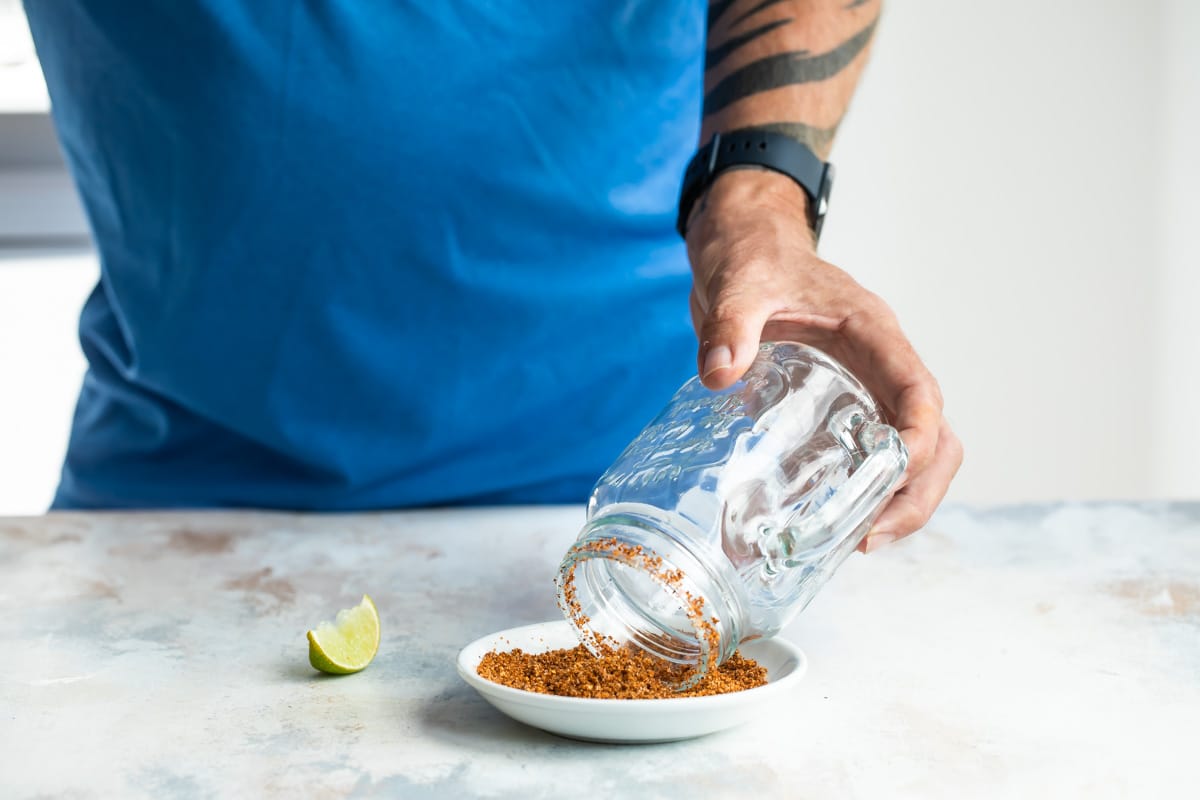 Rimming a glass with tajin for Micheladas.