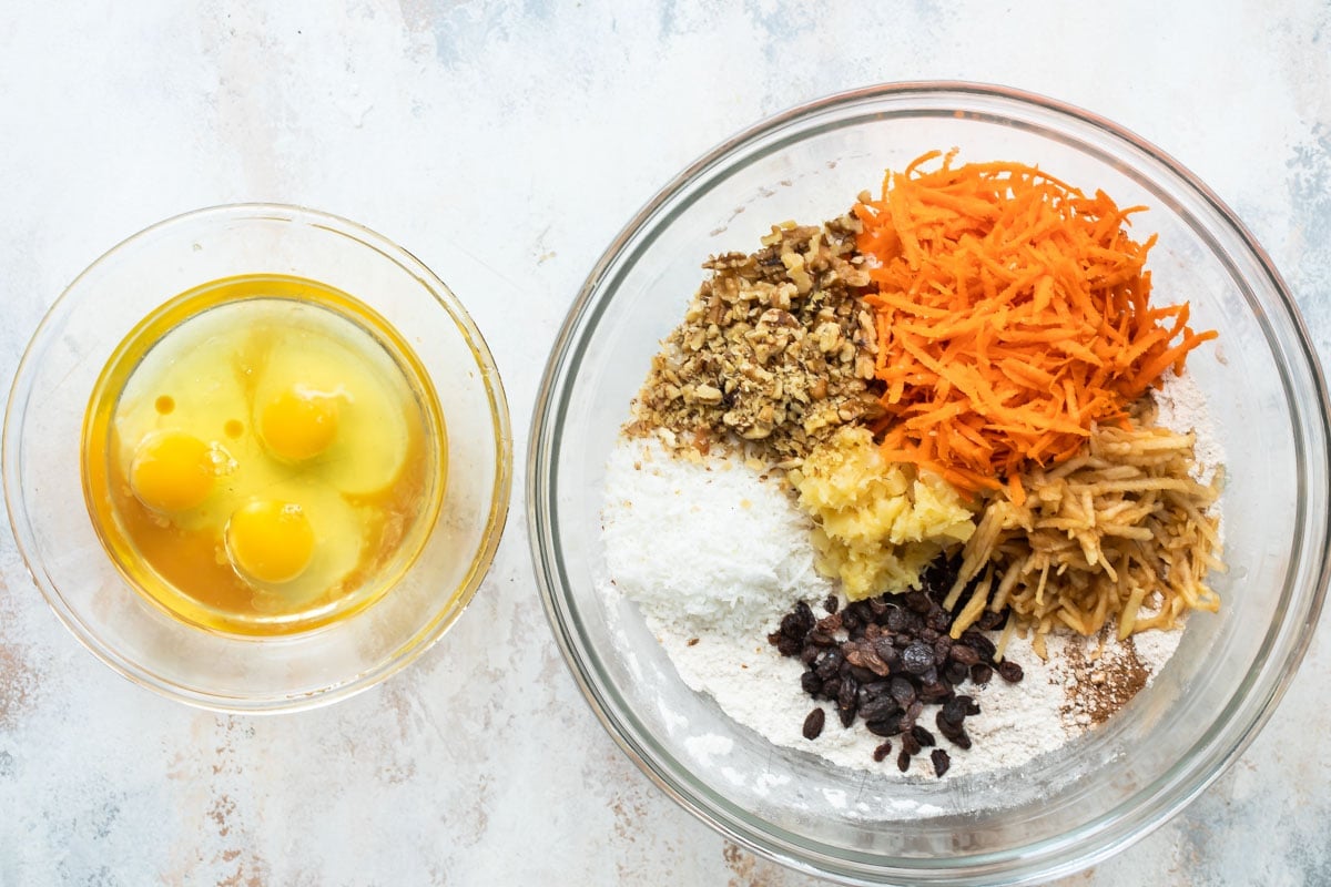 Ingredients in two bowls for morning glory muffins.