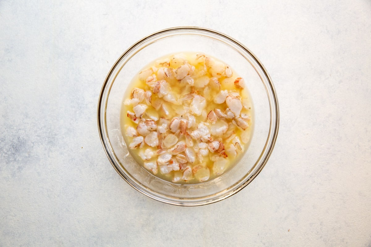 Raw shrimp in citrus juice for ceviche.