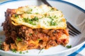 The best make ahead lasagna slice on a white plate.