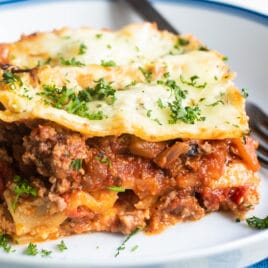 The best make ahead lasagna slice on a white plate.