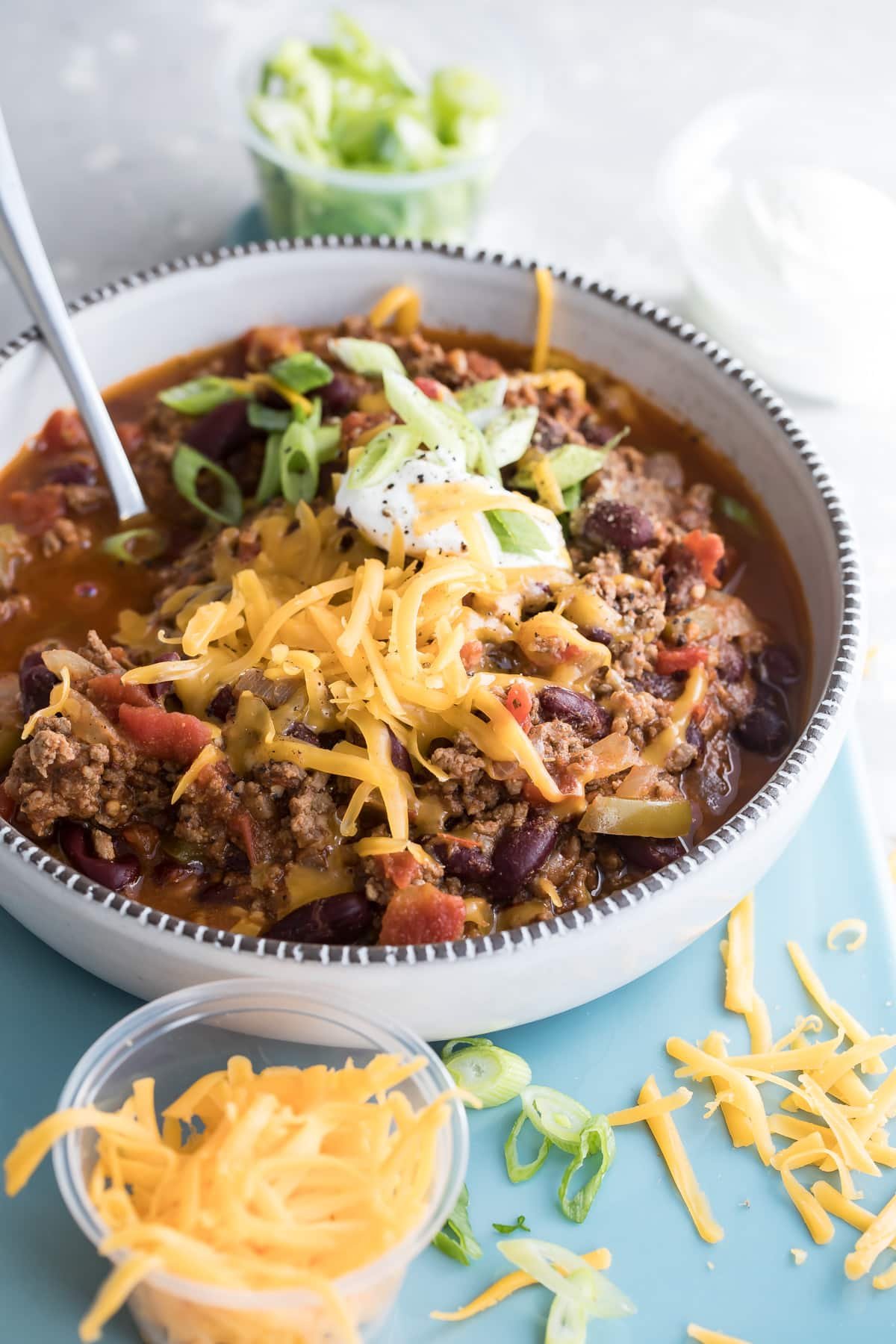Venison chili in a white bowl.