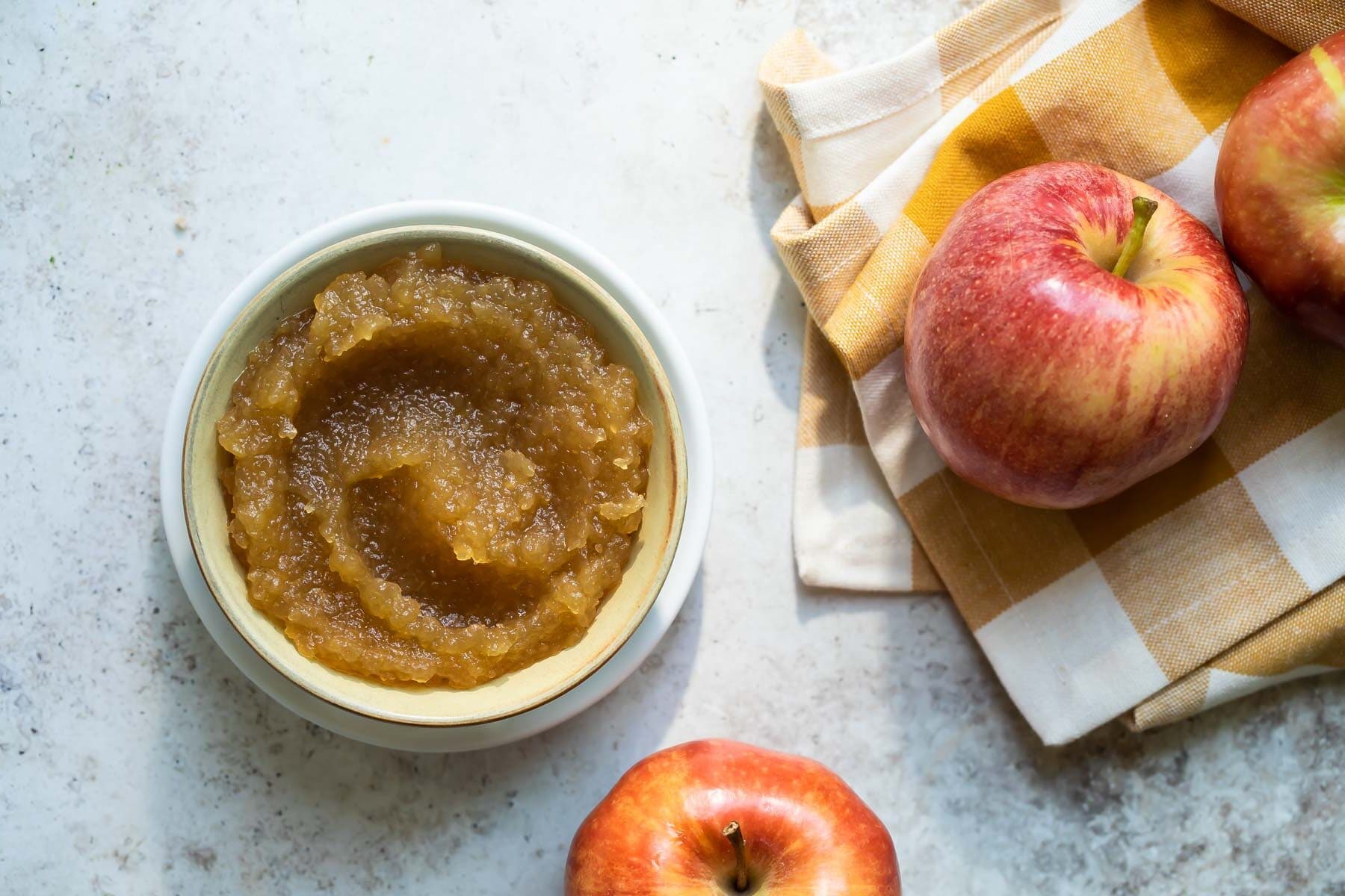 Apple butter in a green bowl.