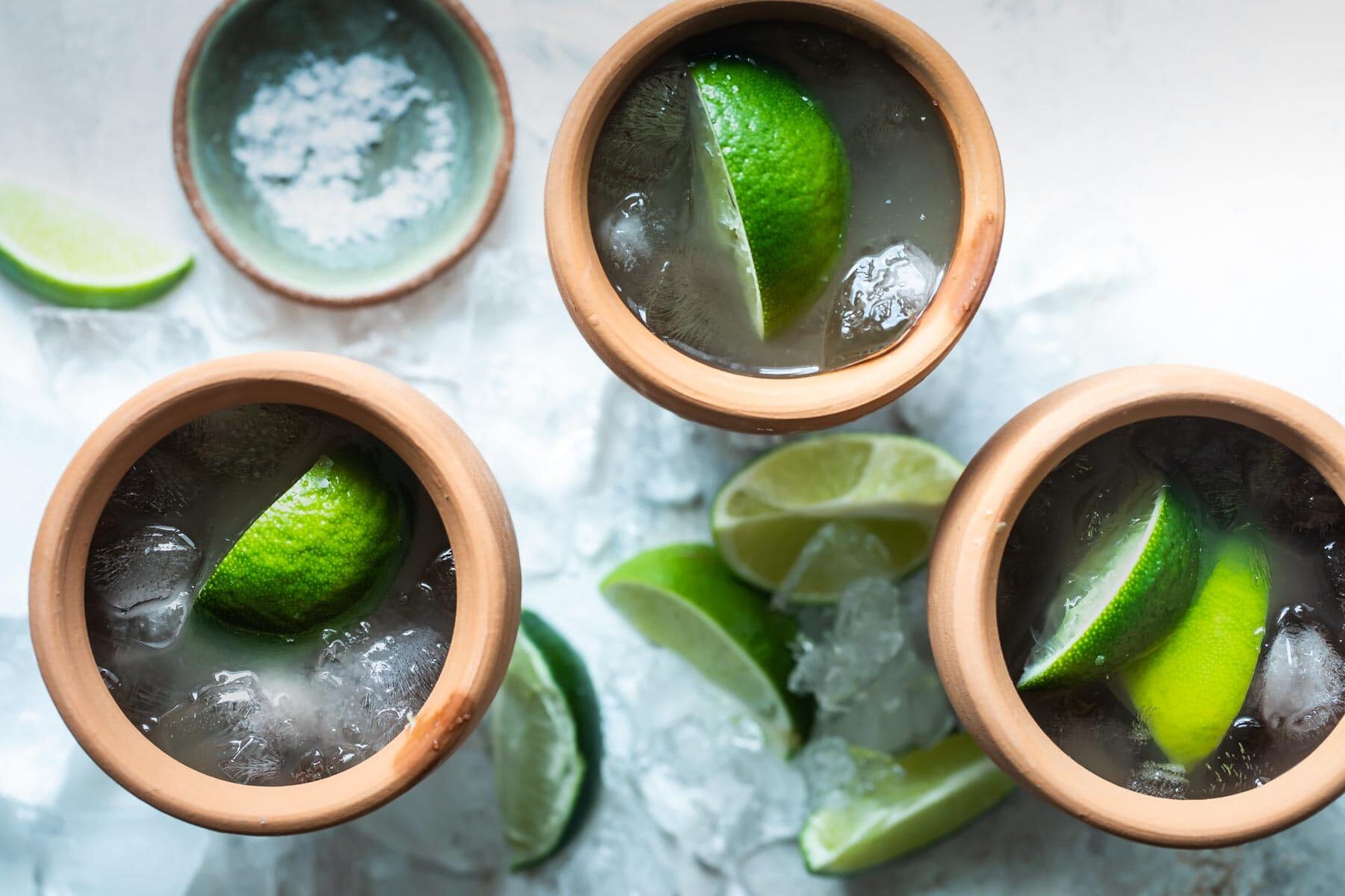3 Cantarito cocktails in clay cups.