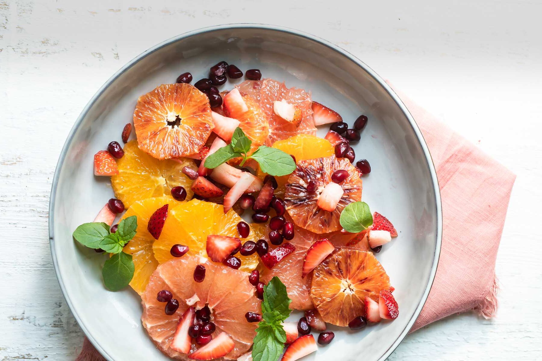 Citrus salad in a gray bowl.