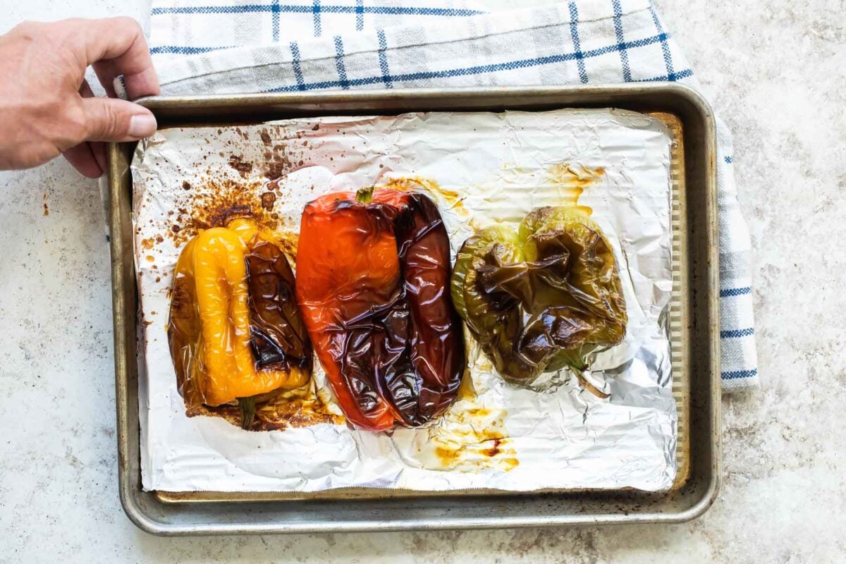 Roasted peppers on a baking sheet.